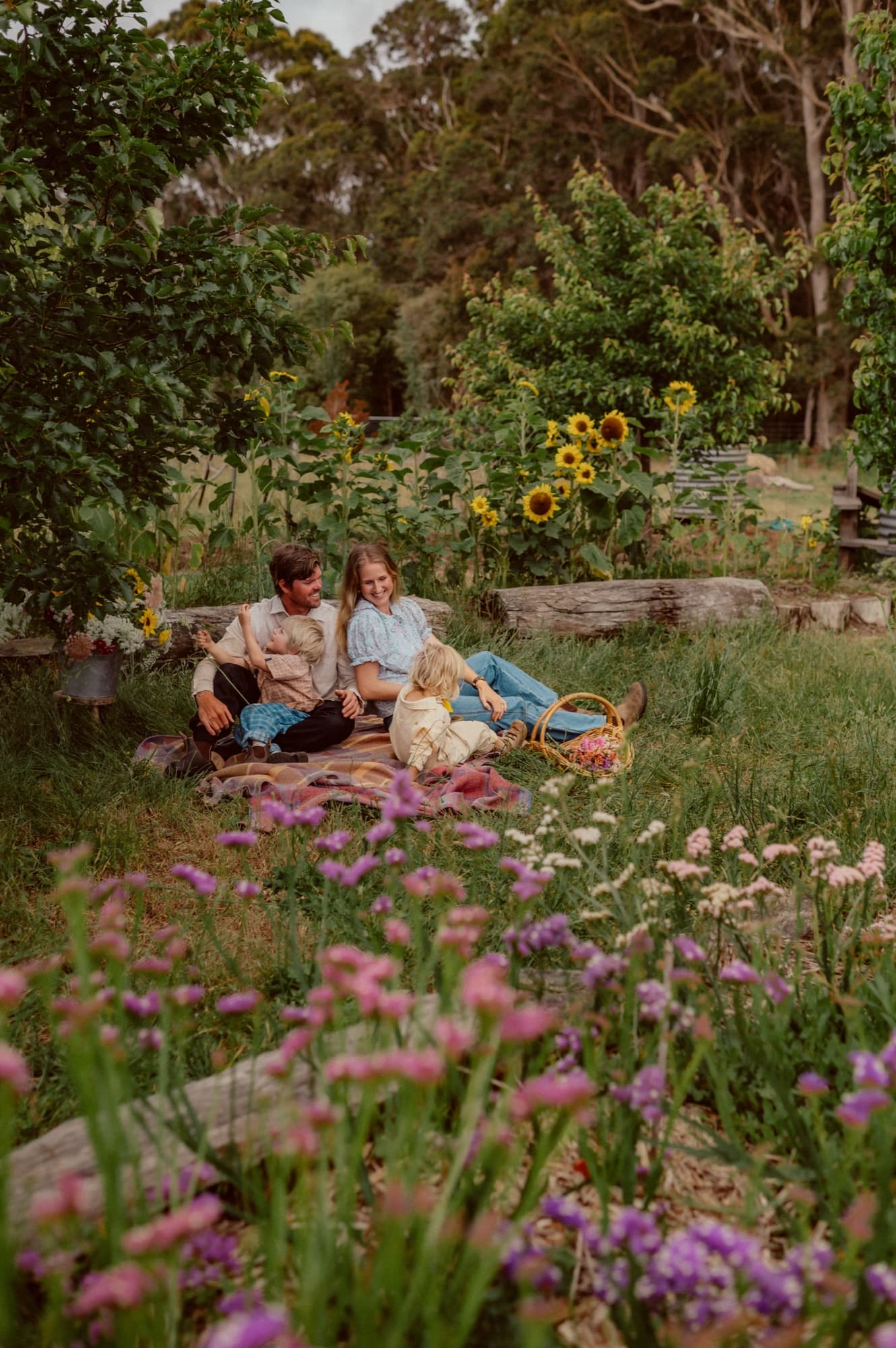 A couple sharing a picnic with the kelpie at the farm — a still from the YouTube channel.