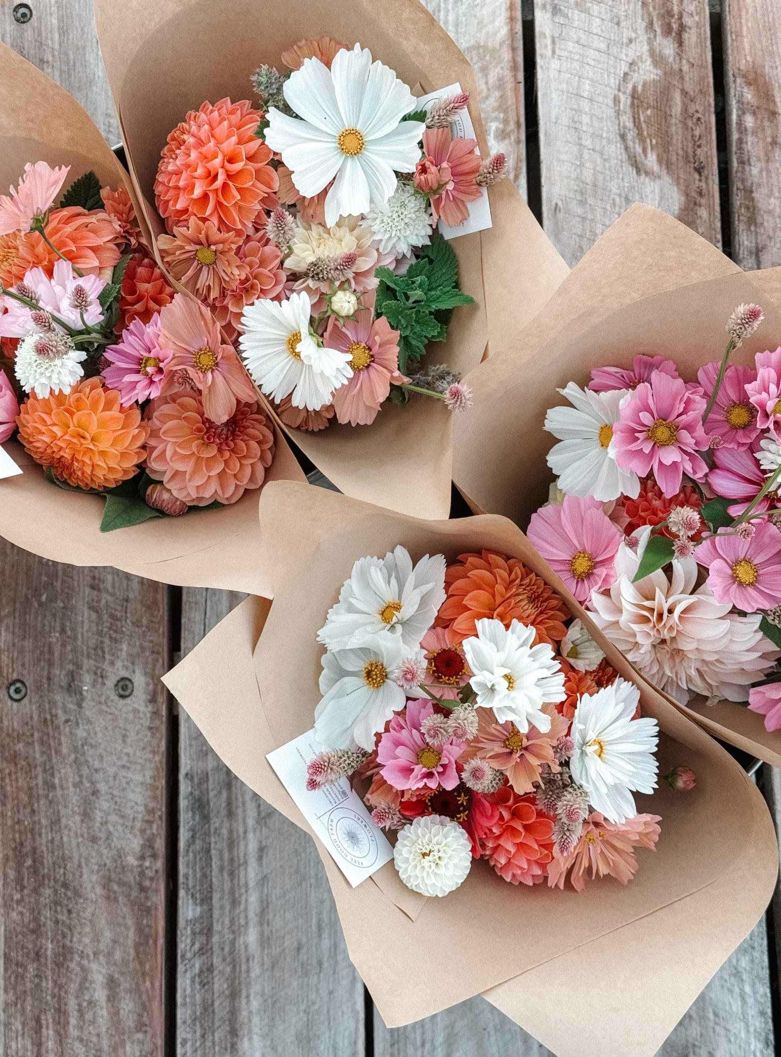 Wrapped bouquets laid out on the bench, ready to go out on the Tuesday run.